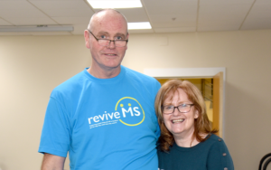 Picture man in light blue shirt with revive MS written on the front.