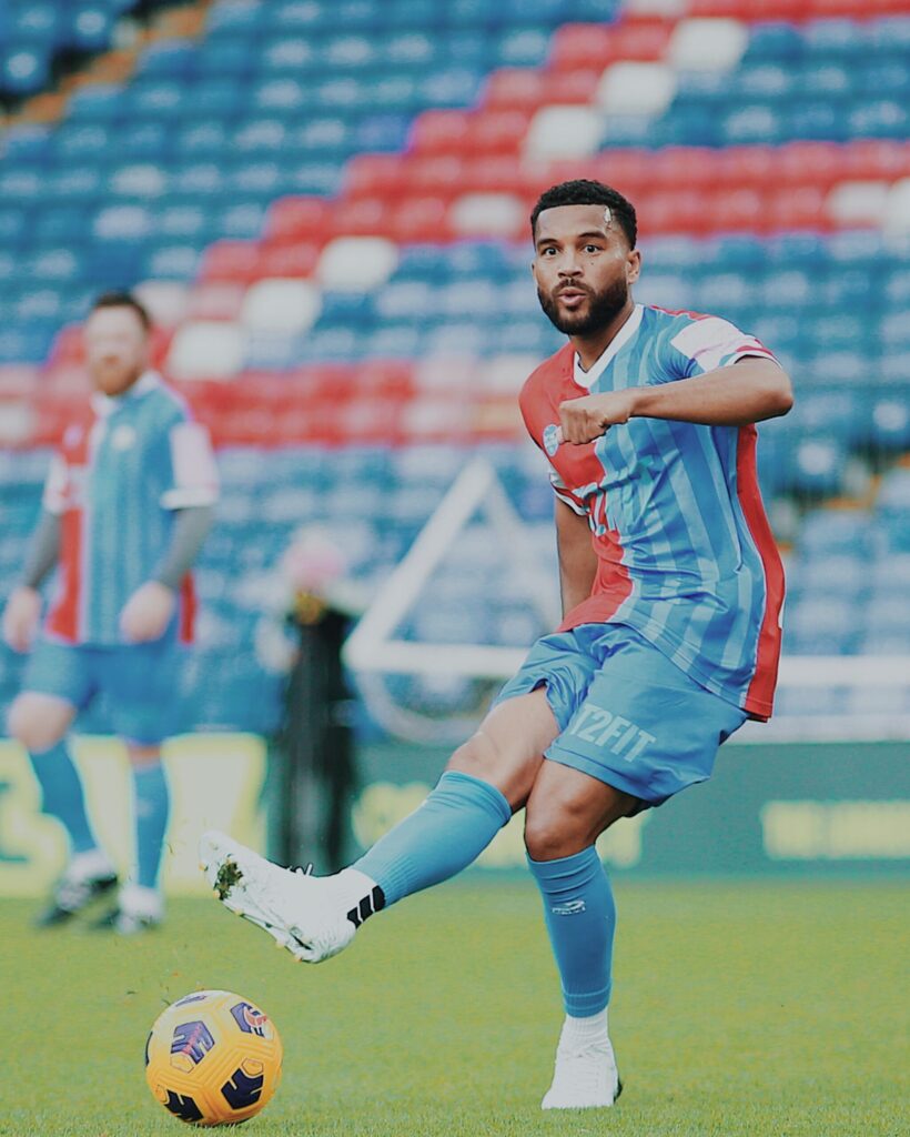 Adrian Mariappa shooting a ball.