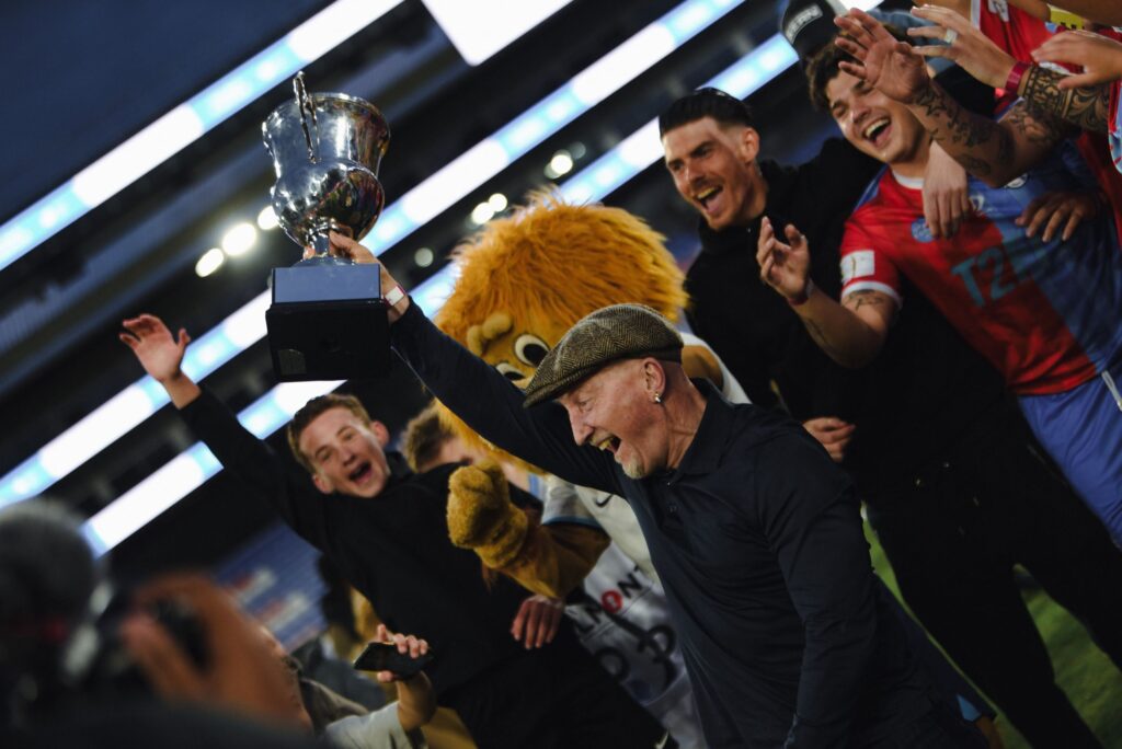 Ian Holloway holding the winners cup