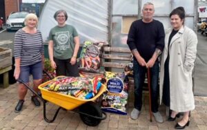 4 people standing in front of the garden centre