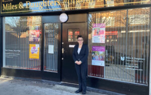 Catherine Shaw standing in front of branch